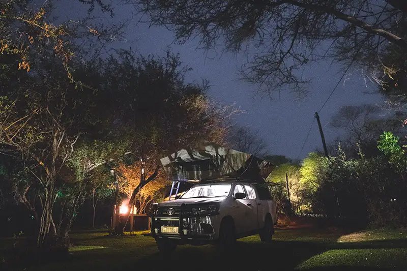 Camping at Night 4x4 Seld-Drive Car with rooftop tent